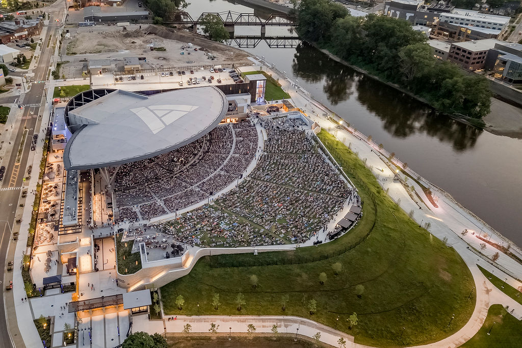 Aerial of riverfront concert amphitheater in the evening